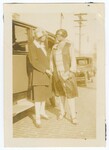 Two Women Standing Next to Automobile
