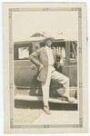 Unidentified Man Leaning on Automobile