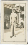 Unidentified Man Standing Outside Building