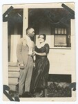 Unidentified People Standing in Front of House by Fox Tone Print, Fox Co.