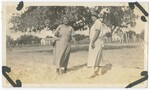 Women Standing in Field by Fox Co.