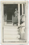 Woman Standing on Porch