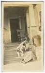 Woman With Dog Sitting on Steps