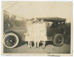 Women Standing In Front of Automobile