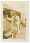 Woman Leaning on Automobile