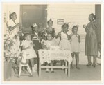 Unidentified Women and Children Celebrating At A Party