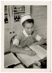 Unidentified Nurse Writing in a Ledger