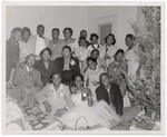 Group Photograph of Unidentified People Next to Christmas Tree