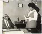 Unidentified Man and Woman in Office