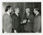 J. W. Herbert Holds Award Plaque by Blue Cross of Florida, Inc. and Blue Shield of Florida, Inc.