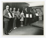 Employees Accept Plaques for their Service by Blue Cross of Florida, Inc. and Blue Shield of Florida, Inc.