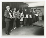 Employees Accept Plaques for their Service by Blue Cross of Florida, Inc. and Blue Shield of Florida, Inc.