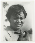 Fernando Victorio Holding Golf Ball by Blue Cross of Florida, Inc. and Blue Shield of Florida, Inc.