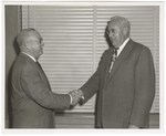 H.A. Schroder and C. Dewitt Miller Shake Hands by Blue Cross and Blue Shield of Florida, Inc.