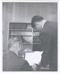 Promotional Photograph: Two People Reading Papers by Blue Cross and Blue Shield of Florida, Inc.