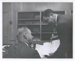 Promotional Photographs: Discussing Paperwork by Blue Cross and Blue Shield of Florida, Inc.