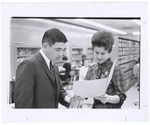 Promotional Photograph: Two People Looking At A Folder by Blue Cross and Blue Shield of Florida, Inc.