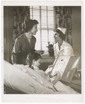 Promotional Photograph: Woman Handing Blue Cross Card to Nurse by Blue Cross and Blue Shield of Florida, Inc.
