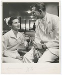 Promotional Photograph: Nurse With Blue Cross Card Next to Doctor by Blue Cross and Blue Shield of Florida, Inc.