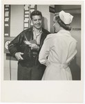 Promotional Photograph: Person Showing Nurse A Blue Cross Card by Blue Cross and Blue Shield of Florida, Inc.