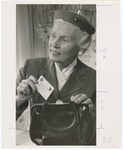 Promotional Photograph: Woman Removing Insurance Card From Handbag by Blue Cross and Blue Shield of Florida, Inc.