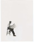 Promotional Photograph: Man reading Blue prints by Blue Cross and Blue Shield of Florida, Inc.