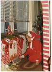 Barbara Davis Wearing a Santa Hat by Blue Cross and Blue Shield of Florida, Inc.