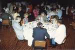 Flaherty (left) eating with others at reception by Blue Cross and Blue Shield of Florida, Inc.