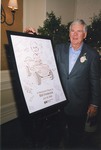 Bill Frederick with retirement poster by Blue Cross and Blue Shield of Florida, Inc.