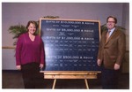 Susan Towler and John Delaney with donor recognition signage by Blue Cross and Blue Shield of Florida, Inc.