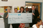 Check presentation to St. Petersburg Free Clinic with Susan Towler by Blue Cross and Blue Shield of Florida, Inc.