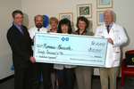 Check presentation to Nemours-Pensacola with Susan Towler by Blue Cross and Blue Shield of Florida, Inc.