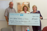 Check presentation to Lakeland Volunteers in Medicine with Susan Towler by Blue Cross and Blue Shield of Florida, Inc.