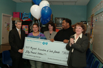 Check presentation to Migrant Association of South Florida with Susan Towler by Blue Cross and Blue Shield of Florida, Inc.