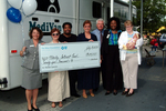 Check presentation to Elderly Interest Fund with Susan Towler by Blue Cross and Blue Shield of Florida, Inc.