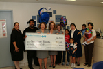 Check presentation to Mercy Hospital Foundation with Susan Towler by Blue Cross and Blue Shield of Florida, Inc.
