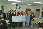 Check presentation to Rural Health Partnership of North Central Florida with Michael Sutton by Blue Cross and Blue Shield of Florida, Inc.