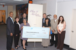 Check presentation to Hispanic Health Initiatives with Tony Jenkins and Susan Wildes by Blue Cross and Blue Shield of Florida, Inc.