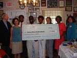 Check presentation to Thelma Gibson Health Initiative by Blue Cross and Blue Shield of Florida, Inc.