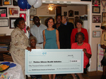 Check presentation to Thelma Gibson Health Initiative by Blue Cross and Blue Shield of Florida, Inc.