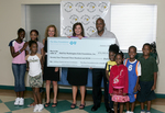 Check presentation to MaliVai Washington Kids Foundation by Blue Cross and Blue Shield of Florida, Inc.