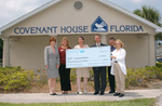 Check presentation to The Covenant House with Susan Towler by Blue Cross and Blue Shield of Florida, Inc.