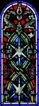 A Stained Glass window with star-shaped geometric patterns by James Dwight Davis