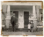 Photograph: Group Portrait, People Standing In Front Of House by R. Lee Thomas