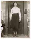 Photograph: Portrait, Woman Standing In Front Of Door by R. Lee Thomas