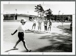 Marathon Participant and Spectators by Spinnaker Media
